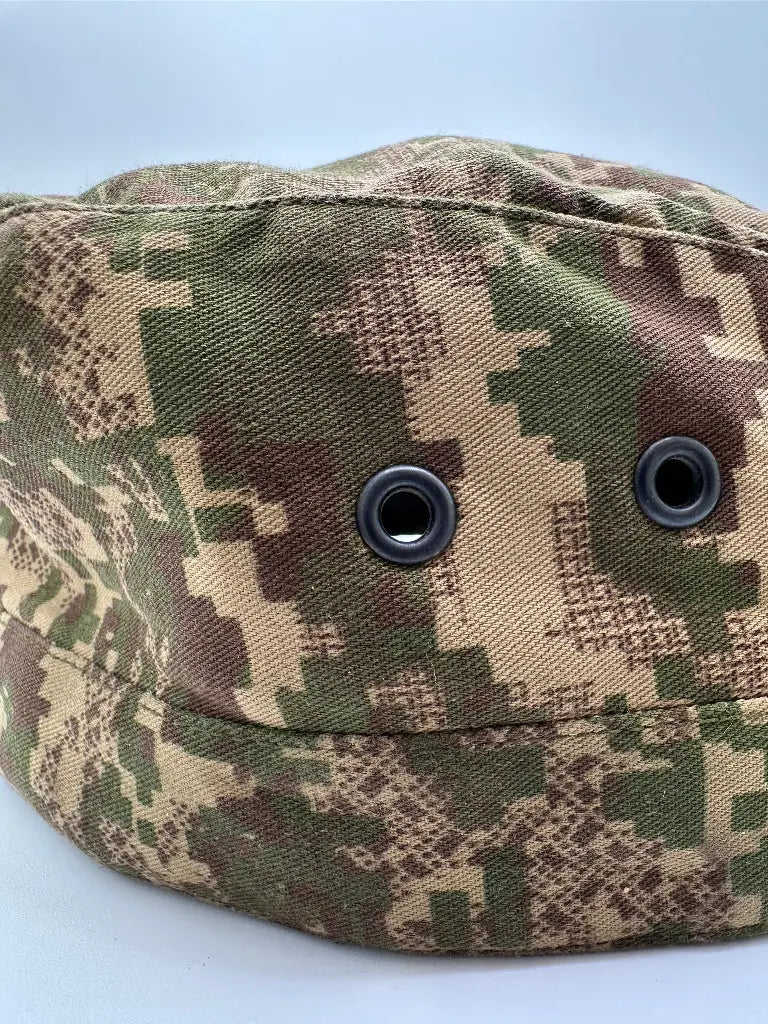 Camouflage-patterned pouch with two buttons on a light gray background