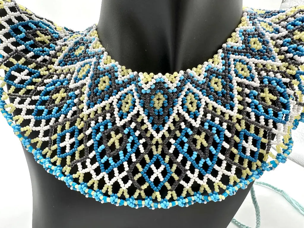 Beaded necklace with geometric pattern on a mannequin