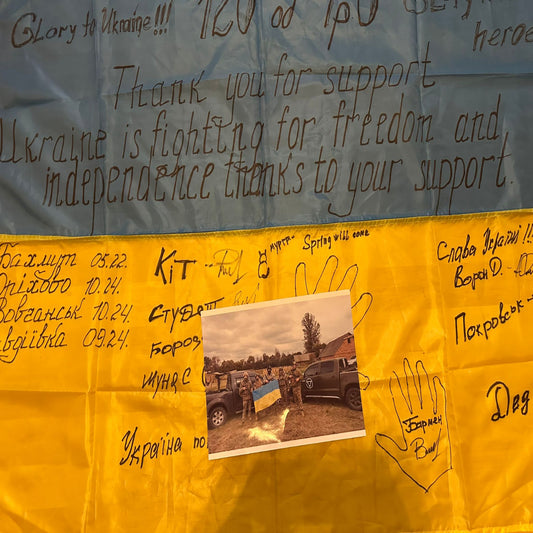 Signed Ukrainian Unit flag with phot showing the people who signed the flag