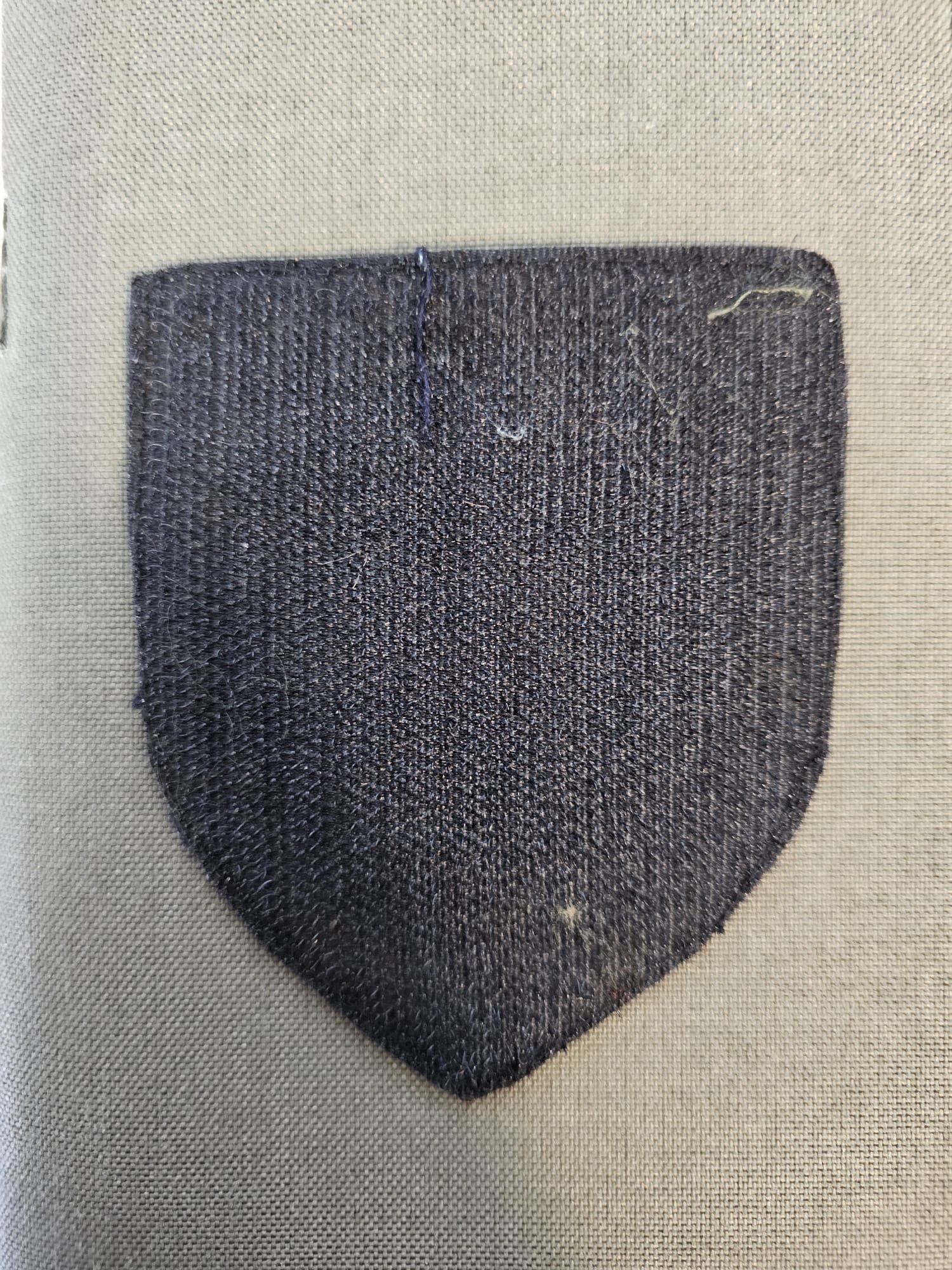 Reverse of the fabric patch showing details of the wear on the velcro.