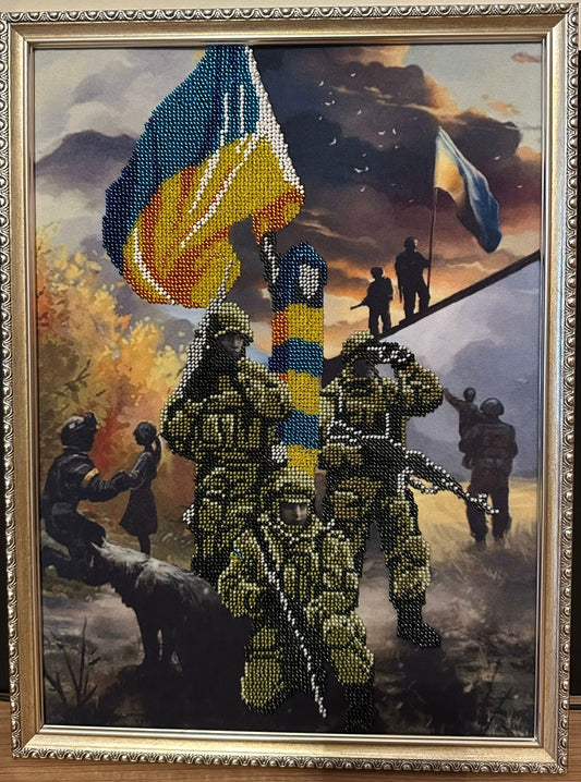 Framed Beadwork picture depicting scenes of Ukrainian soldiers defending the motherland. 3 soldiers are standing guard over the Ukrainian flag and looking out for the enemy