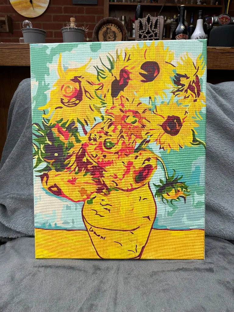 Handmade canvas painting of sunflowers in a vase, predominantly yellow and green, representing a vibrant artistic piece.