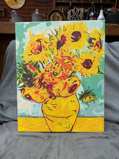 Handmade canvas painting of sunflowers in a vase, predominantly yellow and green, representing a vibrant artistic piece.