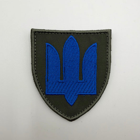 Ukrainian Mechanised Troops shield-shaped patch featuring a bright blue embroidered trident on olive-green fabric with an olive stitched border.