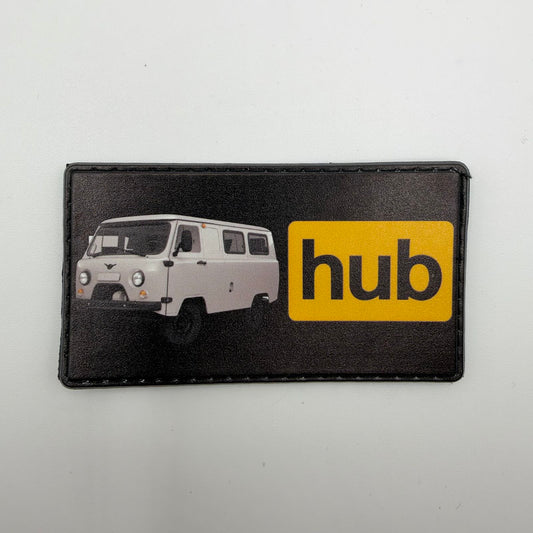 Black rectangular BUKHANKAhub morale patch featuring a white Bukhanka “loaf” van beside black “hub” lettering inside a yellow rectangle.