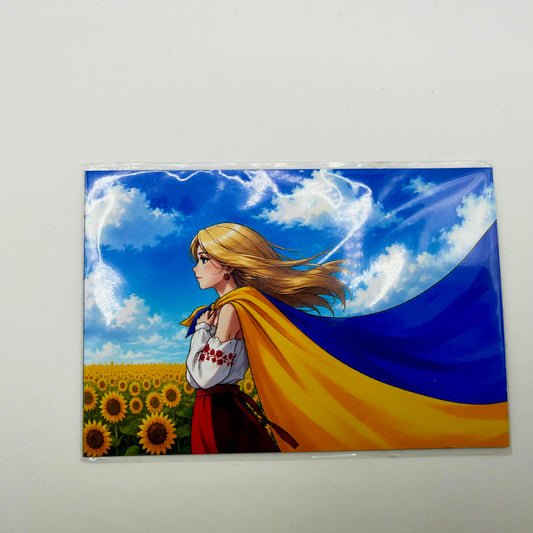 Fridge magnet showing a blonde woman in a white embroidered blouse amid sunflowers, with a Ukrainian flag flowing from her shoulders.