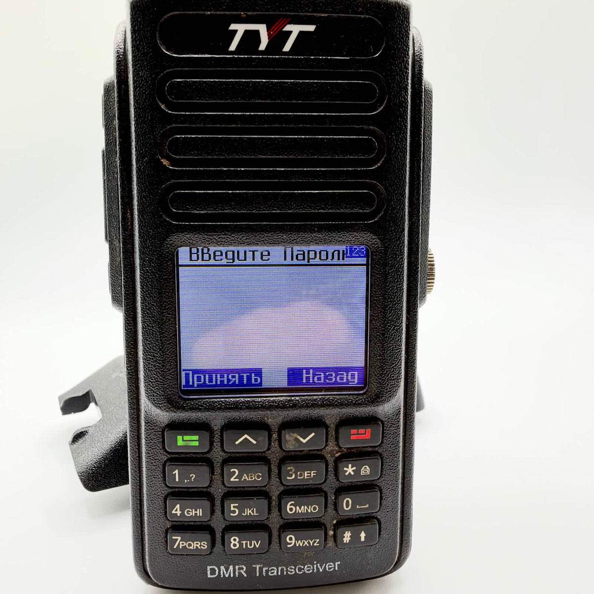 Close-up of the TYT radio displaying a Russian-language “Enter password” prompt above its numerical keypad.