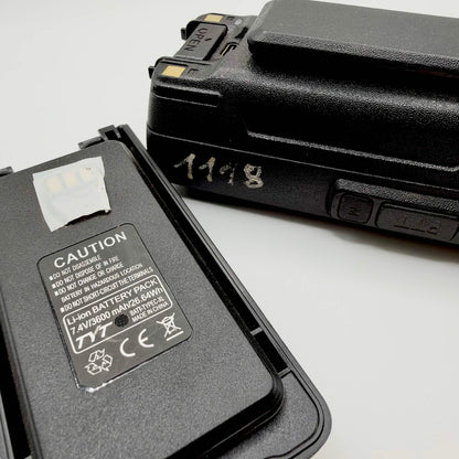 Close-up of the TYT battery label showing 7.4V and 3600mAh, beside the radio’s handwritten identification number.
