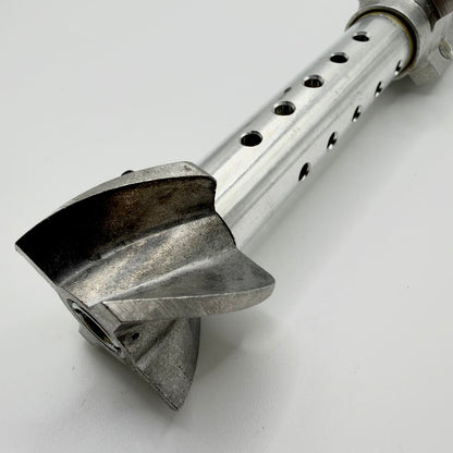 Close-up of the stabiliser’s curved rear vanes and perforated metal tube, showing surface wear and machining marks.