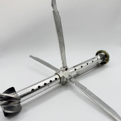 Inert RPG-7-pattern tail stabiliser with its four long fins extended around the central tube and smaller curved vanes at the rear.
