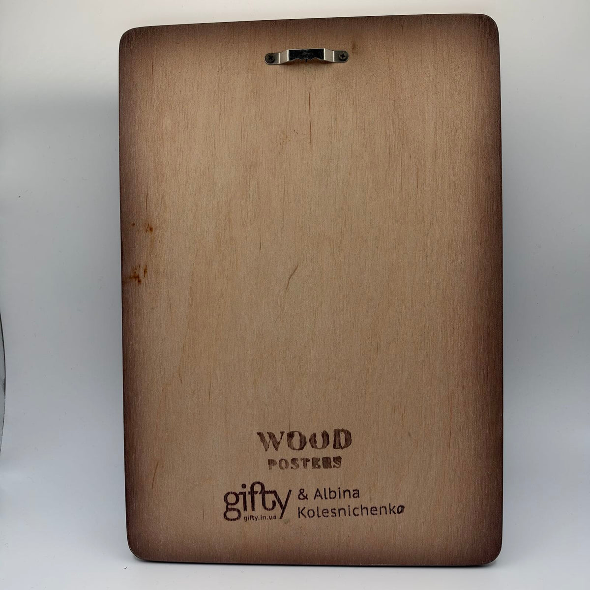 Wooden reverse of the plaque with a metal hanging fitting and branding reading “Wood Posters — Gifty & Albina Kolesnichenko”.