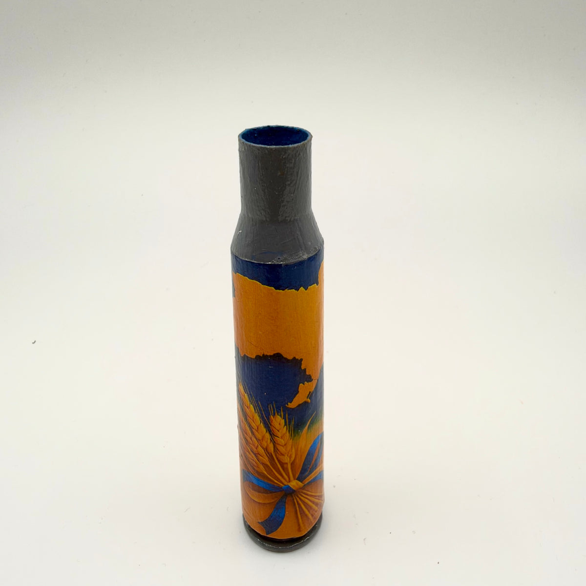 Decorated casing with a grey neck and dark base, featuring a golden-orange map of Ukraine on deep blue above a sheaf of golden wheat tied with a blue and yellow ribbon.