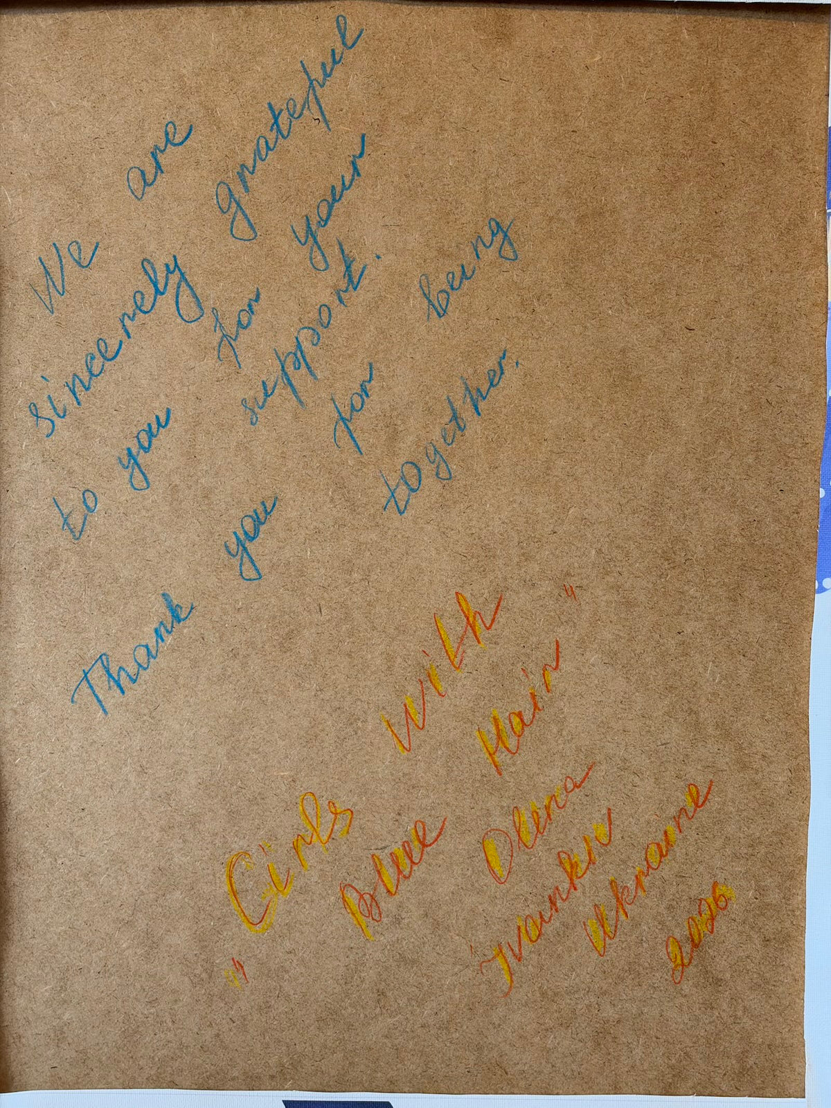 Brown backing board with the handwritten dedication: “We are sincerely grateful to you for your support. Thank you for being together.” Below are the title “Girls with Blue Hair” and the signature Olena, Ivankiv, Ukraine, 2026.