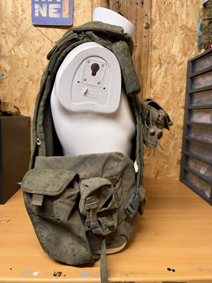 Side view of the captured Russian 6B45 body armour displayed on a mannequin with its collar and pouches attached.