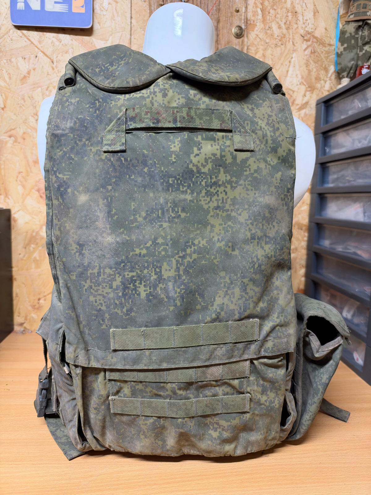 Rear view of the captured Russian 6B45 vest, showing its protective collar, digital camouflage and MOLLE webbing.