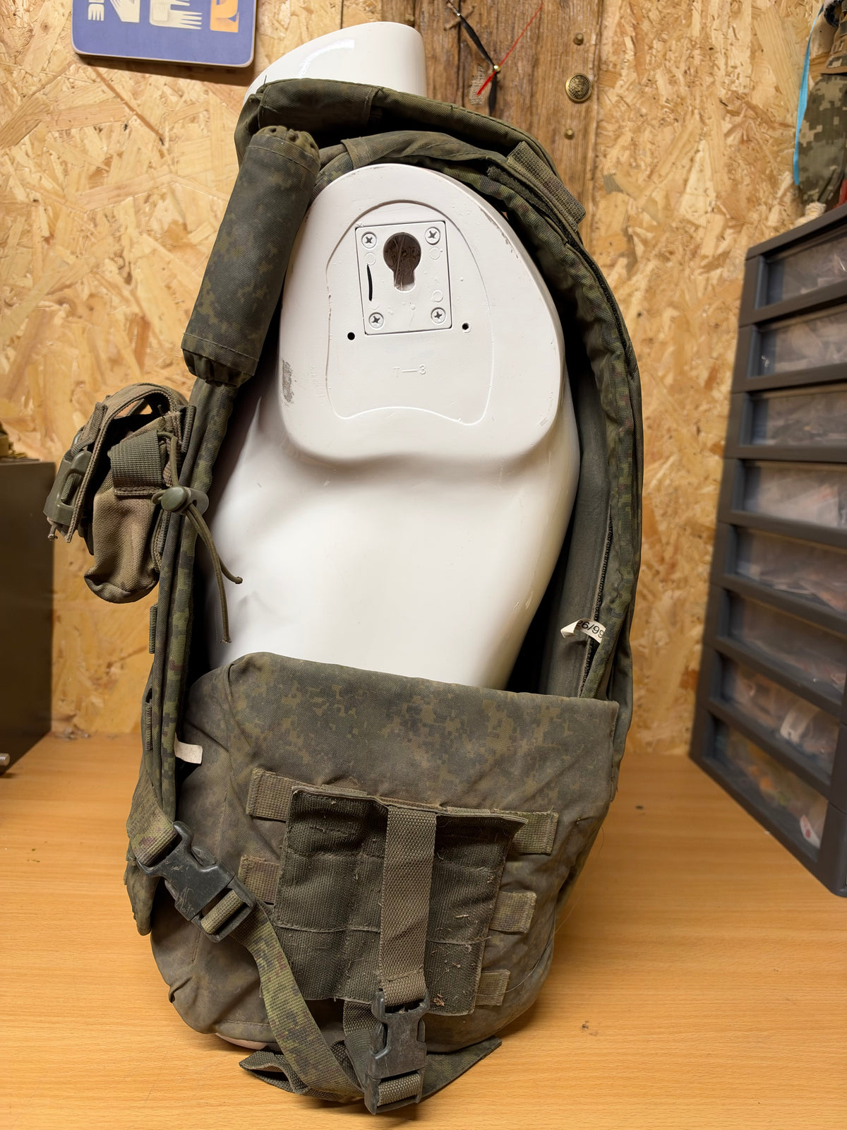 Opposite side view of the captured 6B45 vest on a mannequin, showing its depth, lower protection and attached equipment.