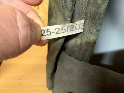 Close-up of a numbered Russian factory or inspection label attached to a component of the captured vest.