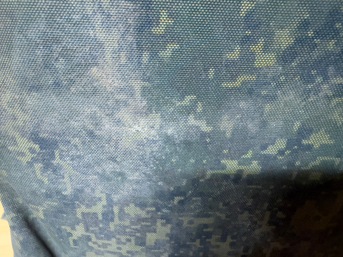 Detailed view of the dirty and heavily worn EMR digital camouflage fabric on the captured Russian vest.