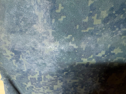 Detailed view of the dirty and heavily worn EMR digital camouflage fabric on the captured Russian vest.