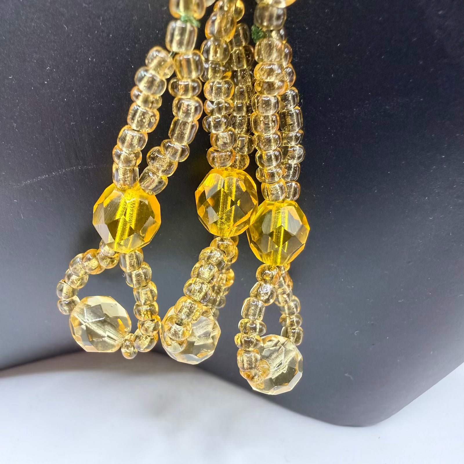 Golden bead necklace closeup