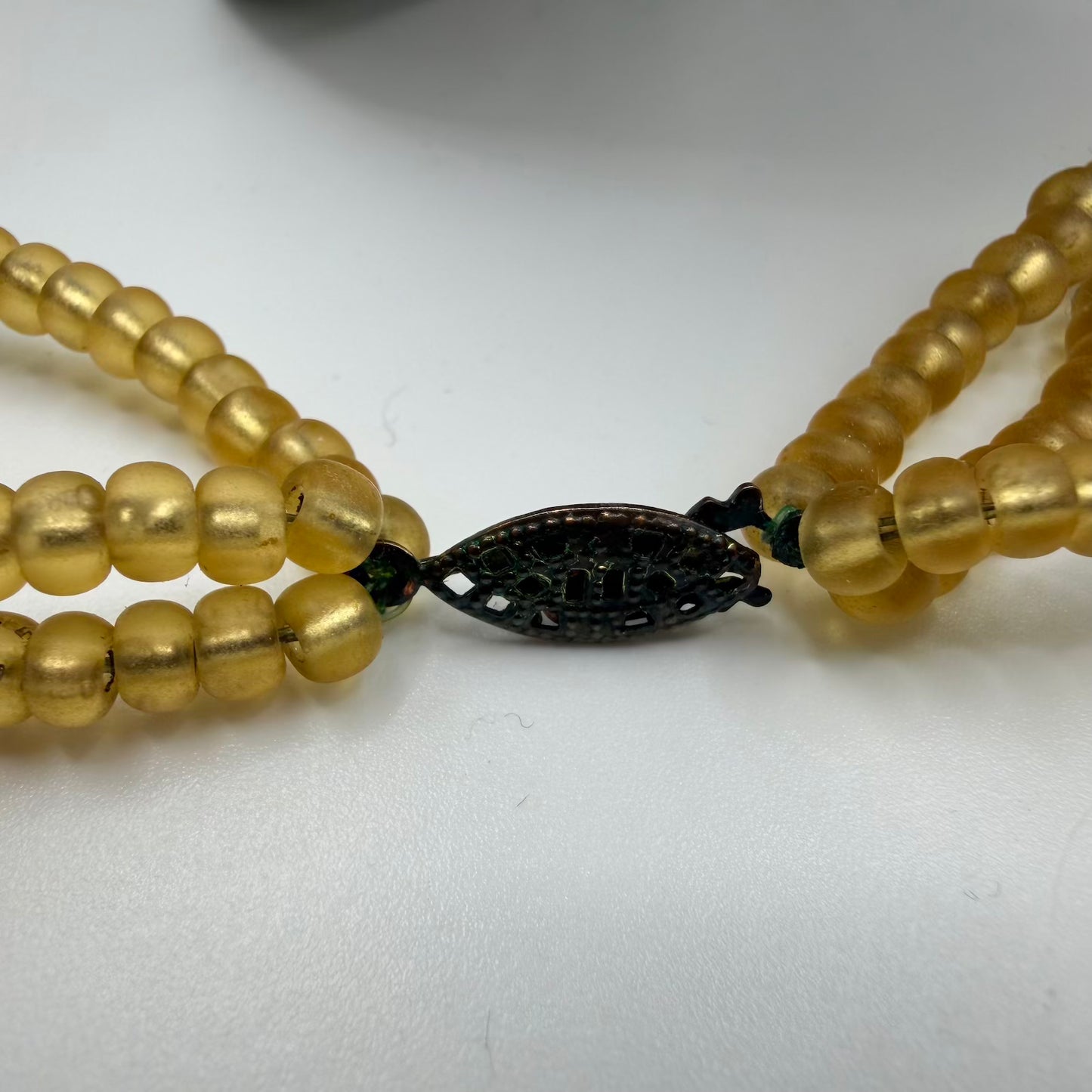 Golden bead necklace clasp