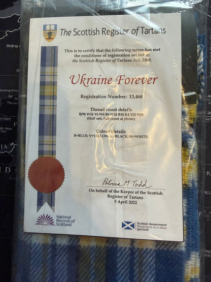 Scottish Register of Tartans certificate for 'Ukraine Forever' design on a tartan fabric background.