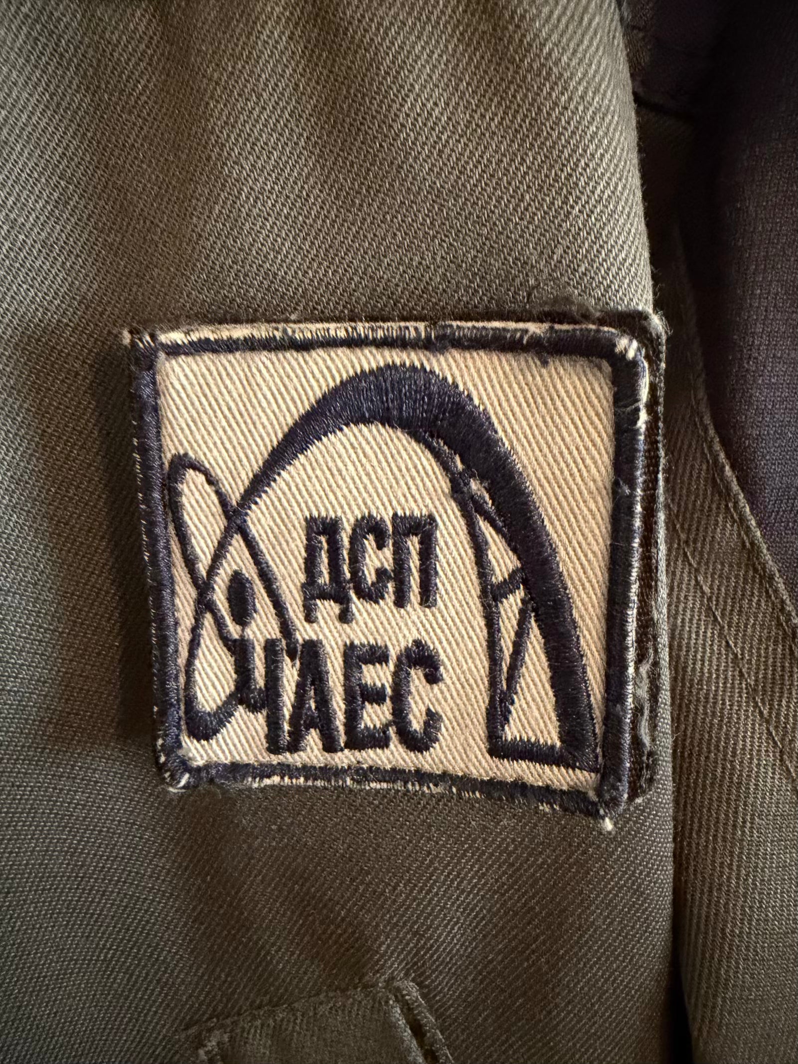 Patch with text and logo on a green background