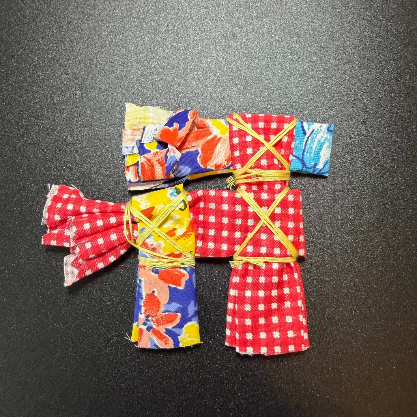 Colorful origami kimono on a black background