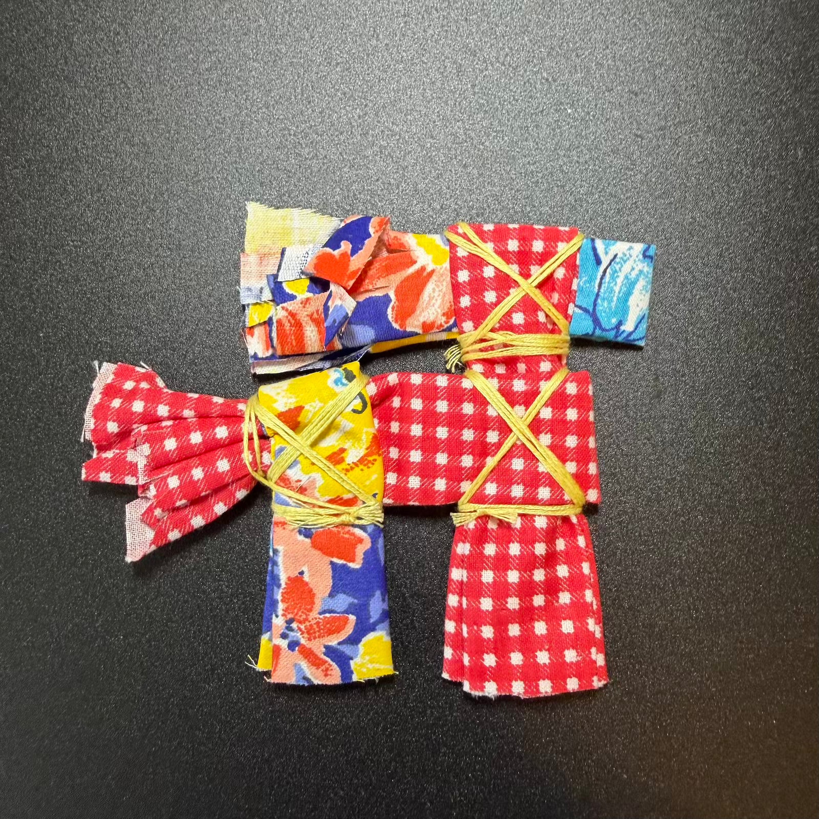 Colorful origami kimono on a black background