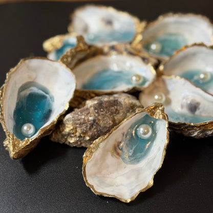 Decorative oyster shells with pearls on a black background