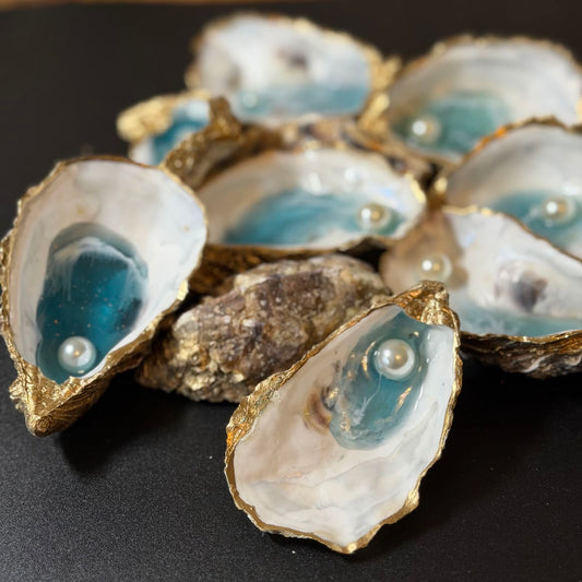 Decorative oyster shells with pearls on a black background