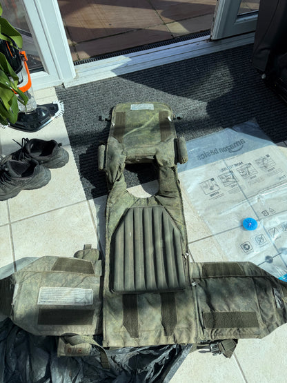 Reverse and interior of the captured Russian 6B45 vest laid open, showing its internal padding and extended protective panels.
