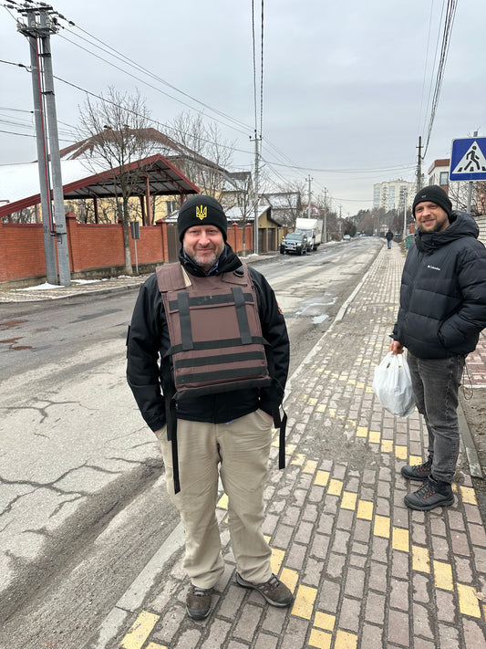 Craig from Ukraine UK Aid wearing the 13.4 kg improvised body armour on the outskirts of Kyiv in early 2024, shortly after it was donated.