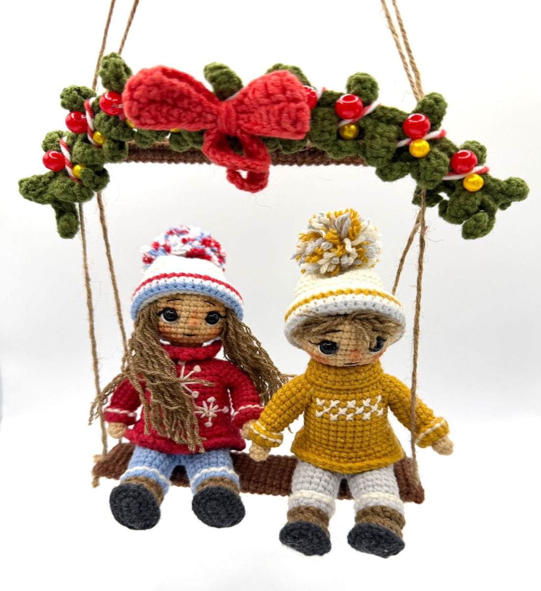 two children sitting on a swing