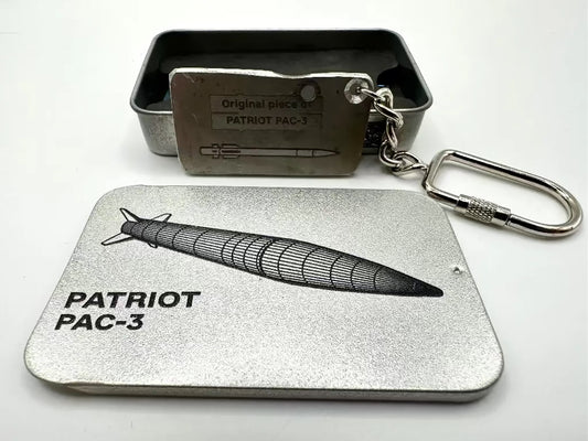 Metal keychain with 'Patriot PAC-3' design on a white background