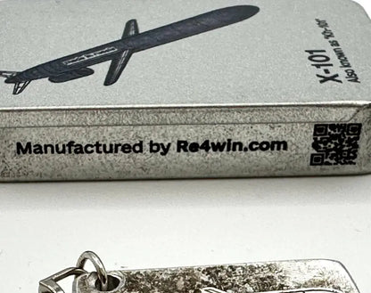 Keychain with airplane design and packaging labeled 'X-101' by Re4win.com on a white background.