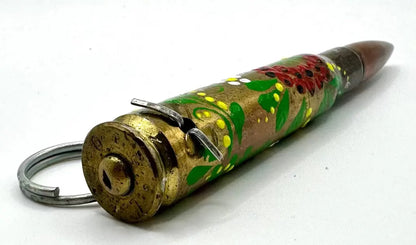 Decorative bullet-shaped keychain with a colorful design on a white background