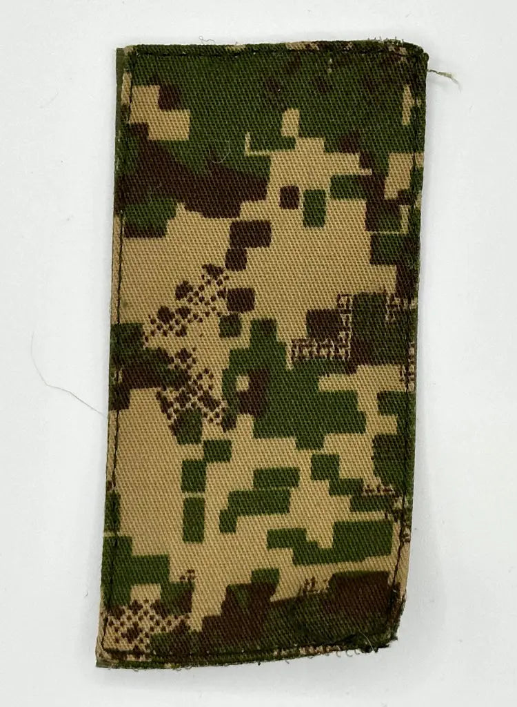 Digital camouflage fabric patch on a white background