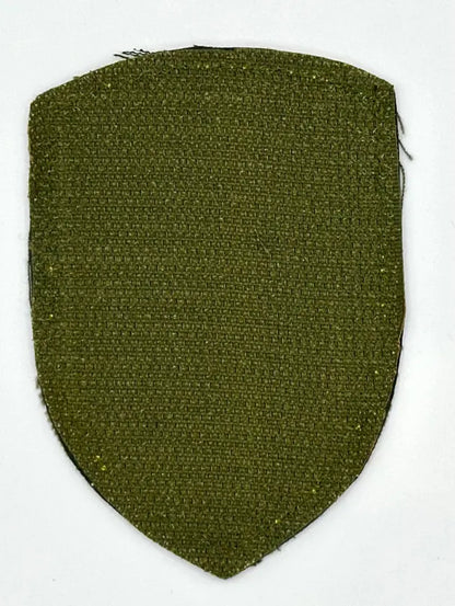 Olive green fabric patch on a white background
