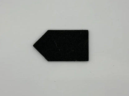 Black arrow-shaped object on a gray background