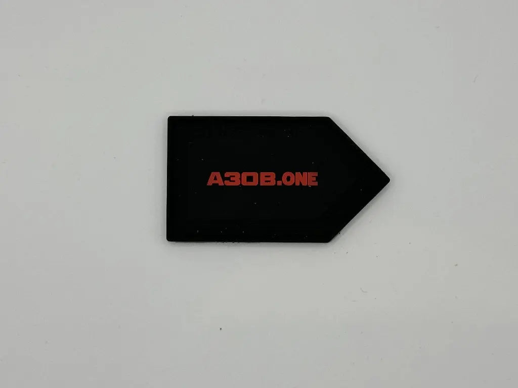 Black arrow-shaped object with 'A308.ONE' in red on a light gray background