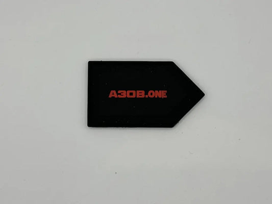 Black arrow-shaped object with 'A308.ONE' in red on a light gray background