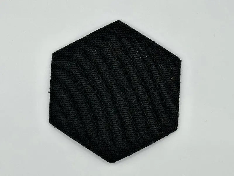 Hexagonal black patch on a light gray background
