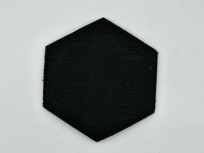 Hexagonal black patch on a light gray background