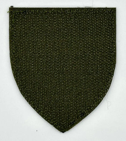 Textured green patch on a white background