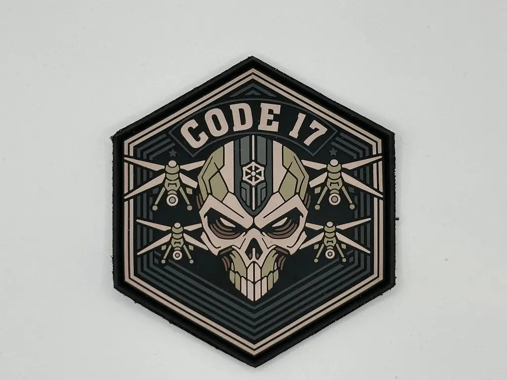 Hexagonal patch with skull design and 'CODE 17' text on a light gray background