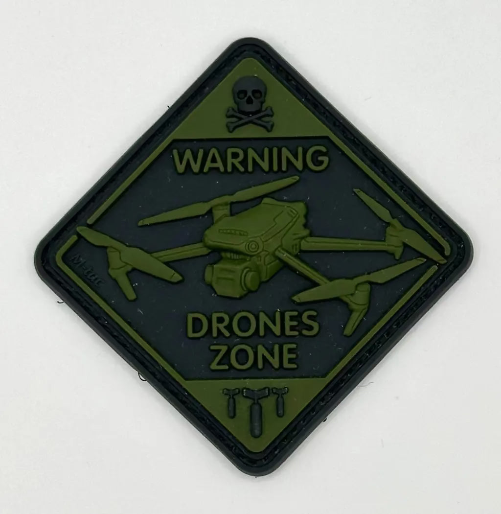 Warning drone zone patch with skull and crossbones symbol on a white background