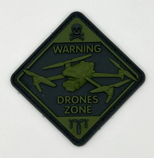 Warning drone zone patch with skull and crossbones symbol on a white background