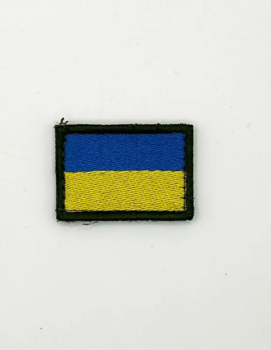 Flag patch with blue and yellow design on a white background