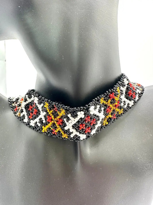 Beaded necklace with geometric pattern on a mannequin